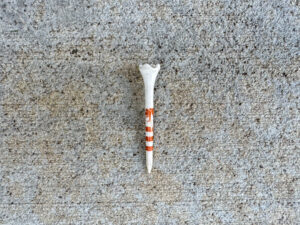 White plastic golf tee