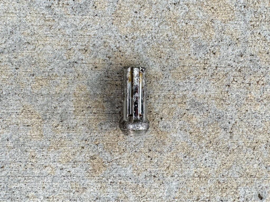 Scuffed chrome lug nut