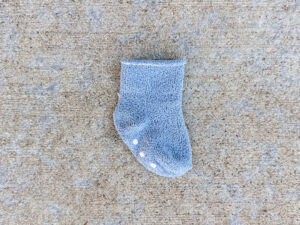 Single light blue baby sock