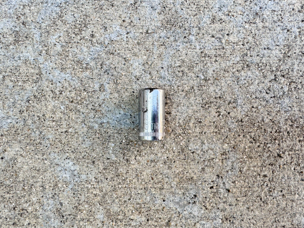 An 8mm 1/4-inch drive Craftsman socket with light scratches and a few small rust spots.