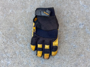 WL HydraHyde work glove with black fabric panels and yellow leather reinforced fingertips and knuckle areas, positioned palm down.